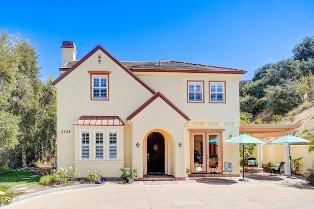 mediterranean / spanish-style home with a patio