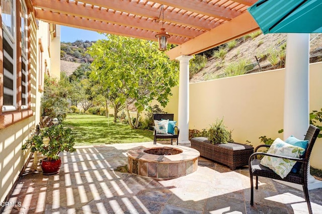 view of patio / terrace featuring a pergola and a fire pit