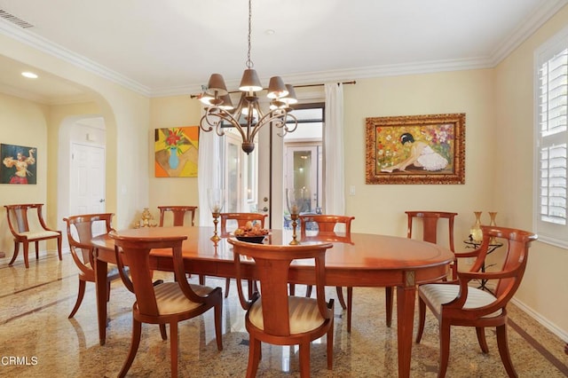 dining room featuring a chandelier and ornamental molding