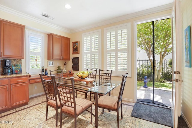 dining room with crown molding