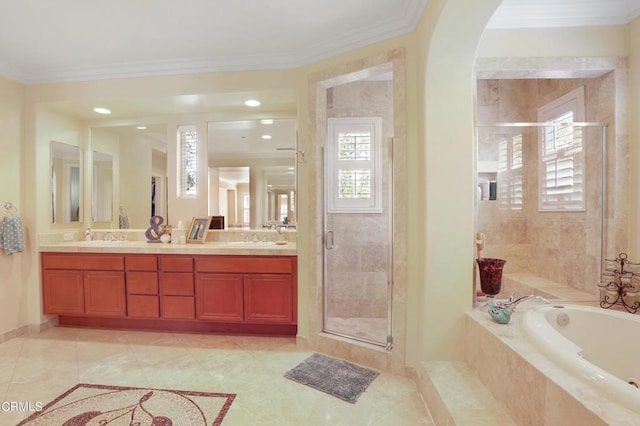 bathroom with shower with separate bathtub, vanity, tile patterned floors, and crown molding