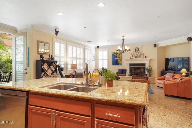 kitchen with light stone countertops, dishwasher, sink, a chandelier, and ornamental molding