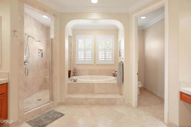 full bathroom featuring vanity, toilet, crown molding, and independent shower and bath