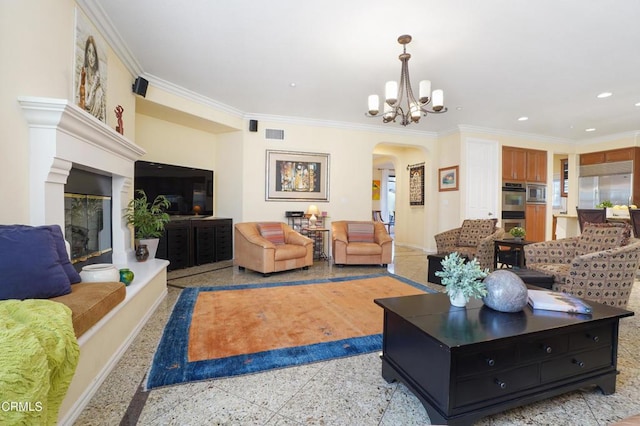 living room with a notable chandelier and ornamental molding