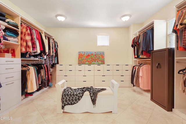 walk in closet featuring light tile patterned flooring