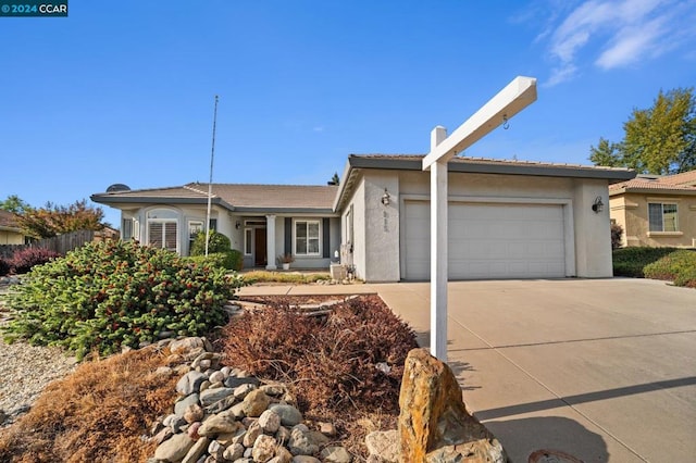 single story home featuring a garage