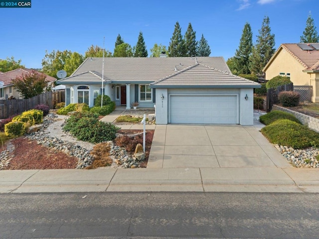 ranch-style home featuring a garage