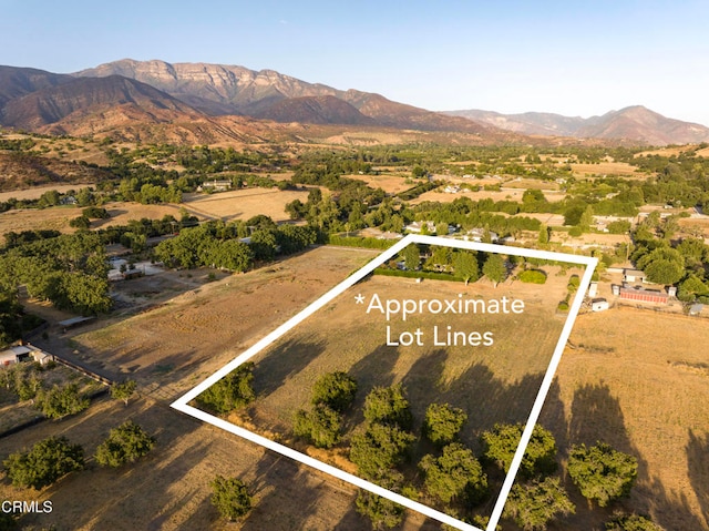 birds eye view of property featuring a mountain view