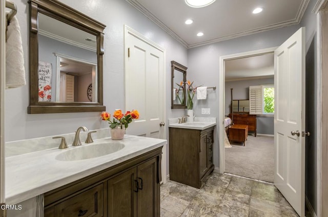 bathroom with crown molding and vanity