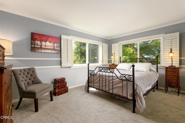 carpeted bedroom with ornamental molding