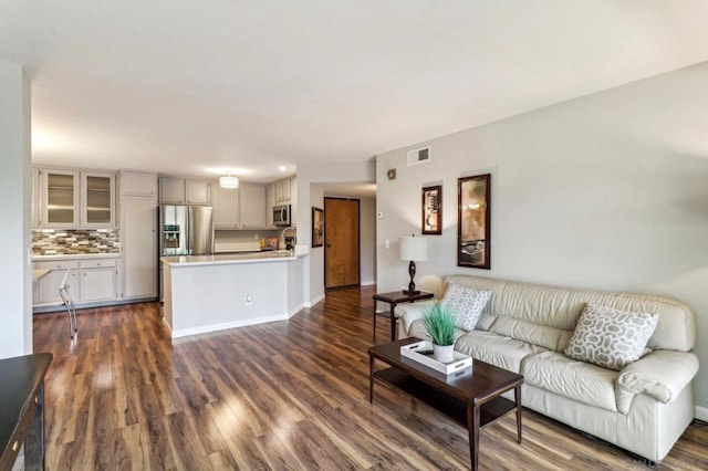 living room featuring dark wood-type flooring