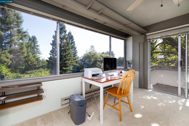 sunroom / solarium featuring ceiling fan and a baseboard radiator