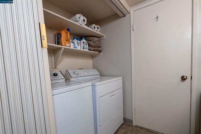 clothes washing area featuring washer and clothes dryer