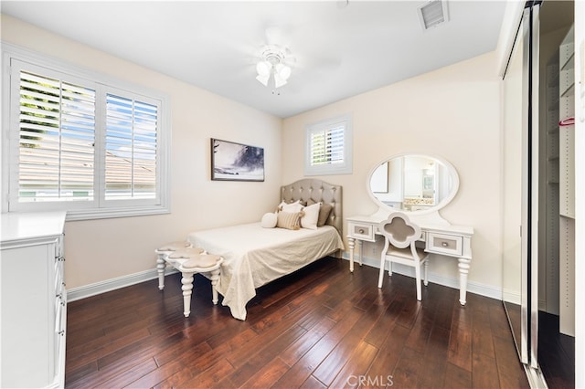 bedroom featuring ceiling fan and dark hardwood / wood-style flooring