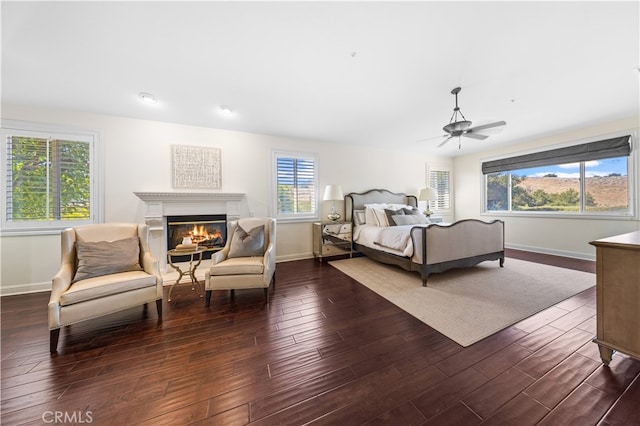 bedroom with ceiling fan and dark wood-type flooring