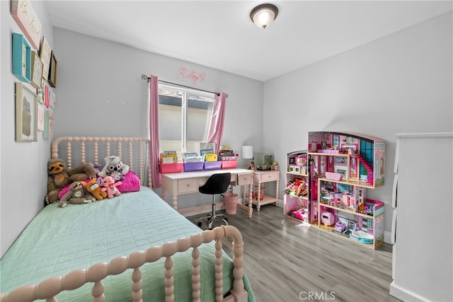 bedroom with wood-type flooring