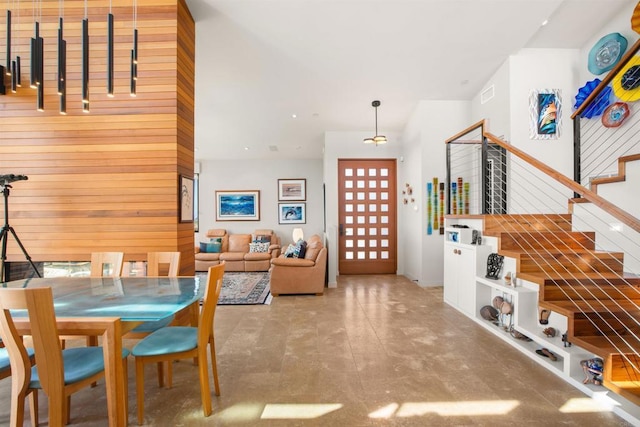 dining room with wooden walls