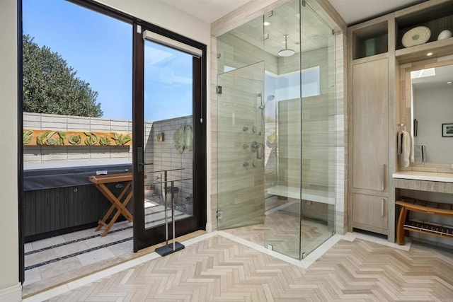 bathroom featuring parquet flooring and walk in shower