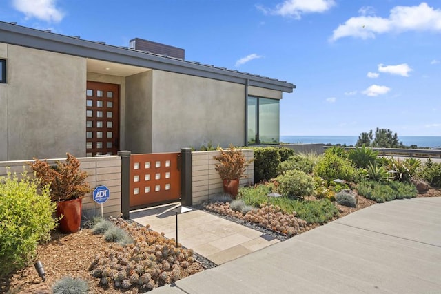 entrance to property featuring a water view