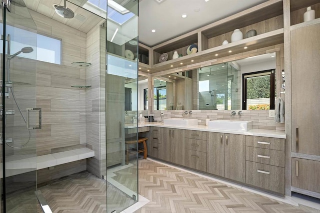 bathroom featuring vanity, a skylight, decorative backsplash, parquet flooring, and walk in shower