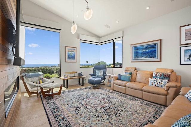 living room featuring light tile patterned flooring and vaulted ceiling