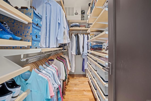 spacious closet with hardwood / wood-style floors