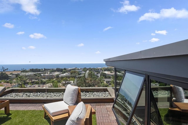 balcony featuring a water view