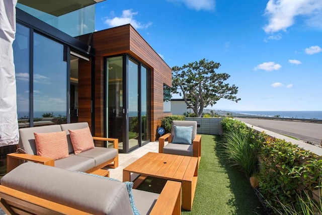 view of patio featuring a water view and an outdoor hangout area