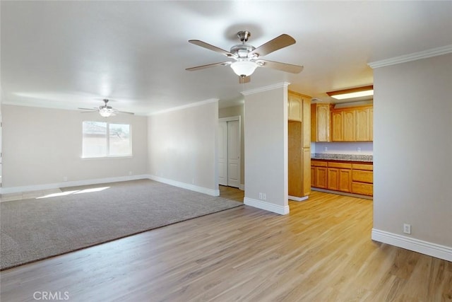 unfurnished living room with ceiling fan, crown molding, and light hardwood / wood-style floors