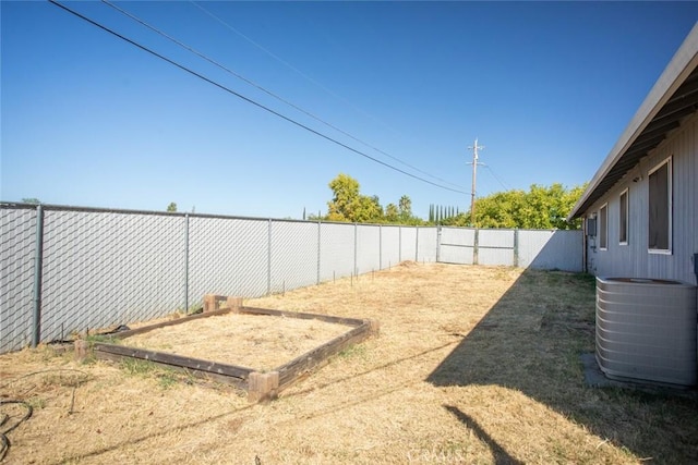 view of yard featuring central air condition unit