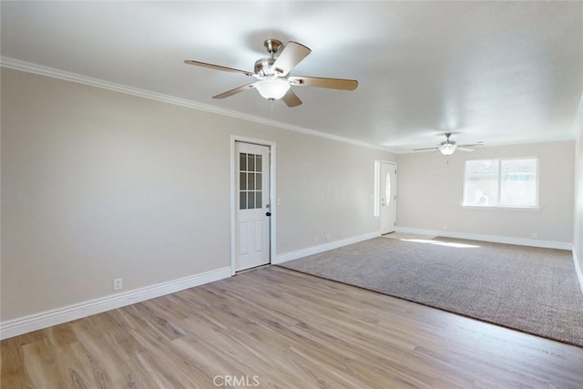 unfurnished room featuring ceiling fan, light wood-type flooring, and crown molding