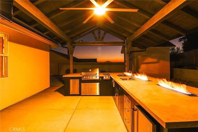 kitchen with beverage cooler, wood ceiling, lofted ceiling with beams, and sink