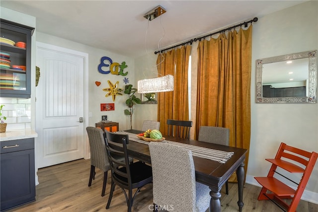 dining area featuring hardwood / wood-style floors