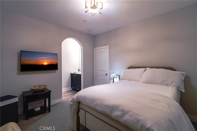 bedroom featuring connected bathroom