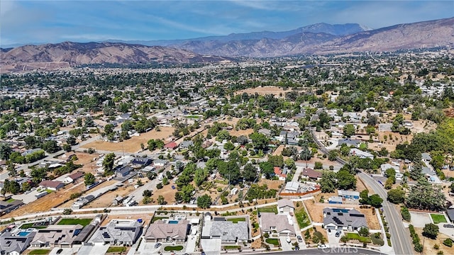 birds eye view of property with a mountain view