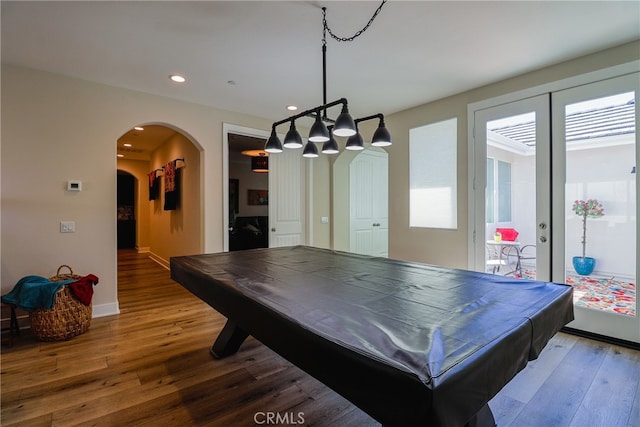 rec room featuring french doors, pool table, hardwood / wood-style flooring, and a healthy amount of sunlight