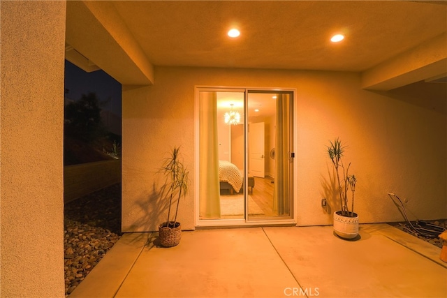 doorway to property featuring a patio area