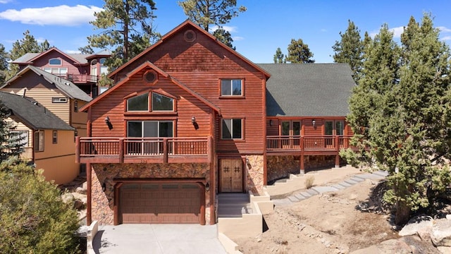 log cabin with a balcony and a garage