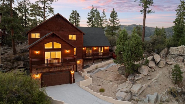 view of front of house with a garage and a mountain view