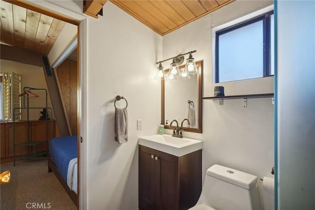 bathroom featuring vanity, toilet, wood ceiling, and ornamental molding