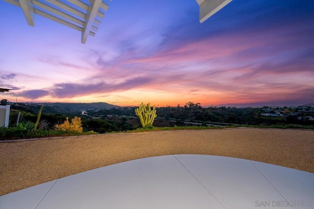 view of patio terrace at dusk