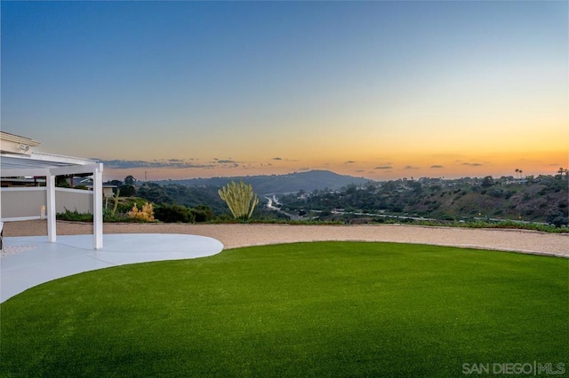 yard at dusk with a mountain view