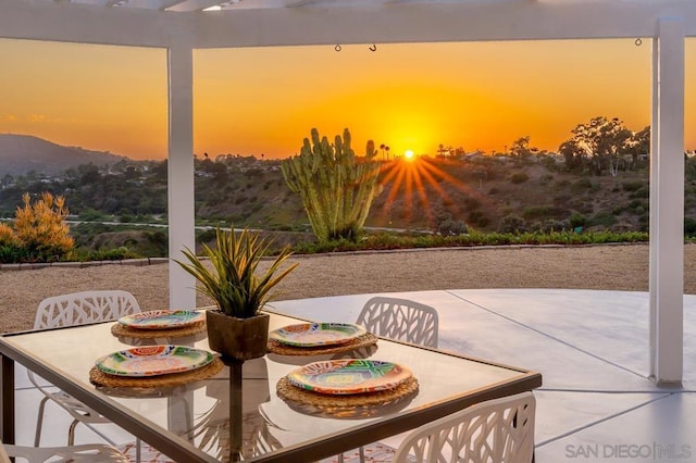 view of patio terrace at dusk