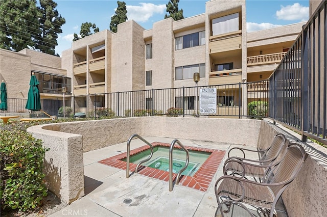 view of pool featuring a community hot tub