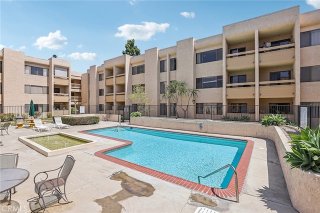 view of pool featuring a patio