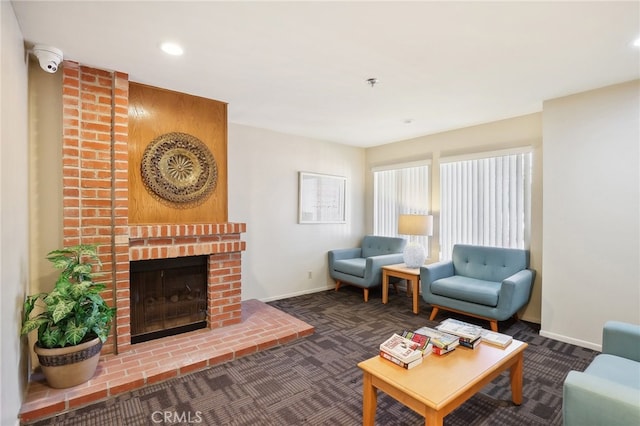 carpeted living room with a fireplace