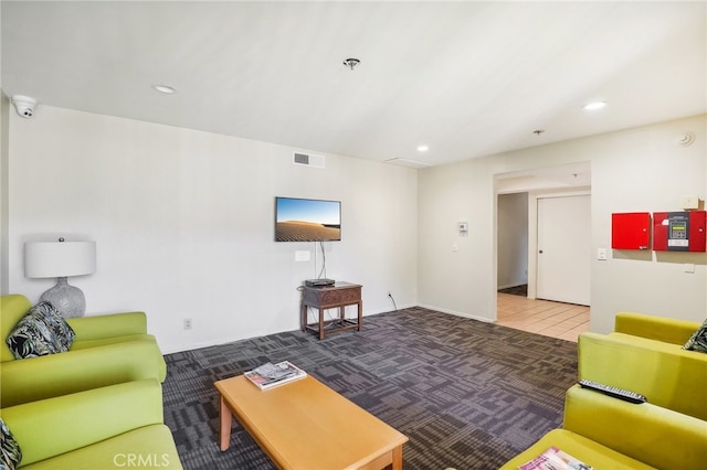 living room featuring dark carpet