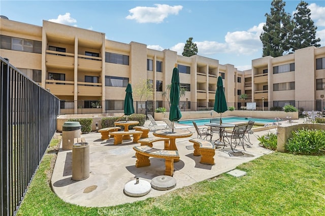 view of swimming pool with a patio