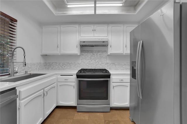 kitchen featuring backsplash, white cabinetry, sink, and stainless steel appliances