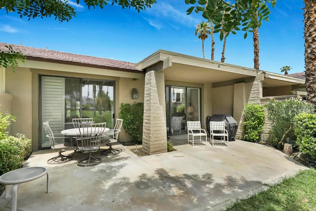 back of house with a patio area